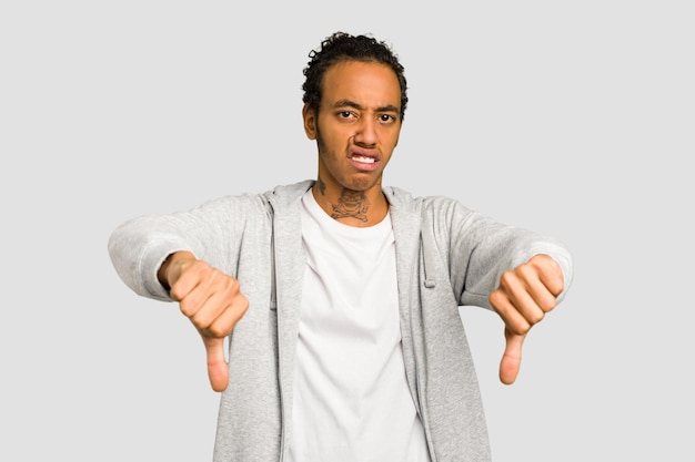 showing thumb down and expressing dislike