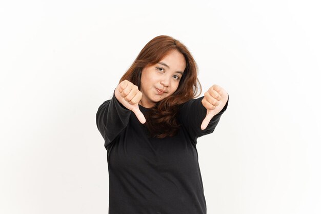 Showing Thumbs Down Of Beautiful Asian Woman Wearing Black Shirt Isolated On White Background