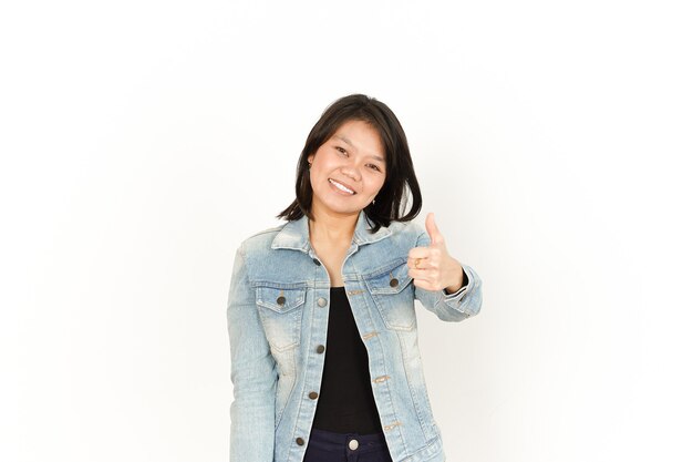 Showing Thumbs Up of Beautiful Asian Woman Wearing Jeans Jacket and black shirt Isolated On White