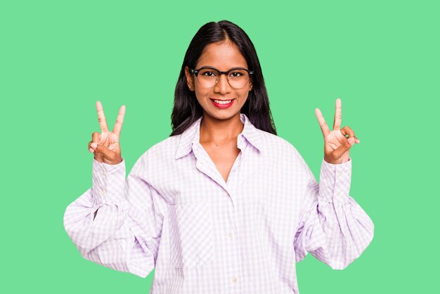 Photo showing victory sign and smiling broadly