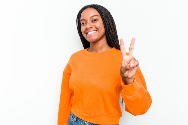 Showing victory sign and smiling broadly