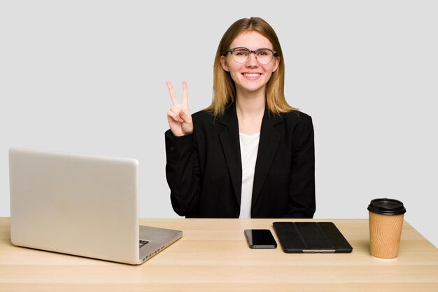 Showing victory sign and smiling broadly