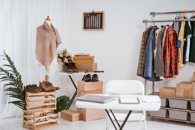 showroom of a clothing store with a desk