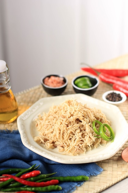 Shredded Chicken on Cream Plate, Seasoned with Various Herbs. In Indonesia Usually used for Stuffing Lemper Ayam