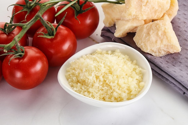 Shredded Italian hard parmesan cheese in the bowl