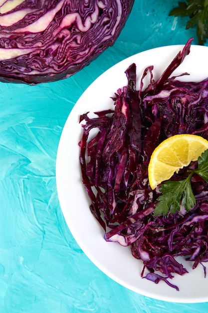 Shredded red cabbage in bowl.