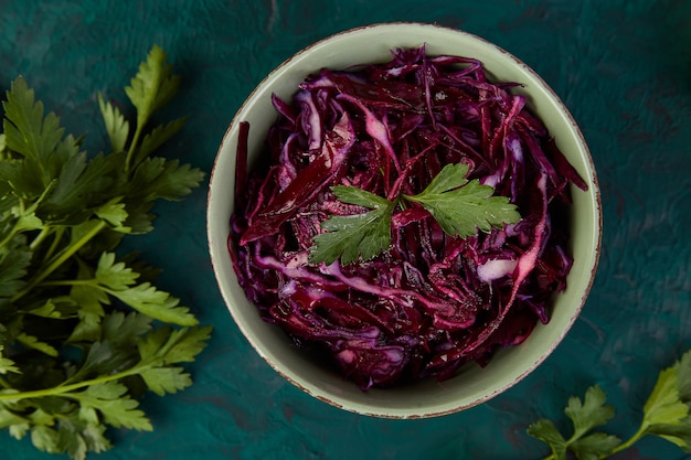 Shredded red cabbage in bowl.