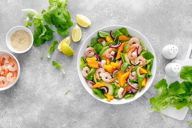 Shrimp avocado and mango salad with fresh green lettuce Prawn salad