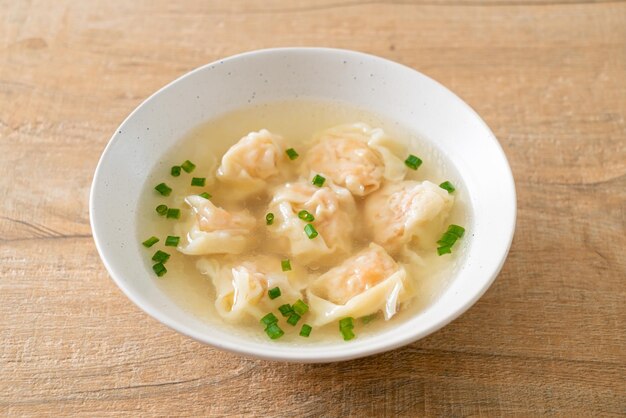 shrimp dumpling soup in white bowl - Asian food style