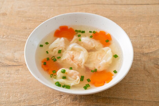 shrimp dumpling soup in white bowl - Asian food style