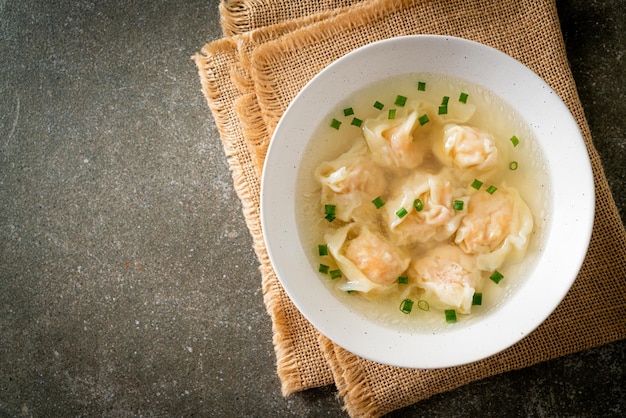 shrimp dumpling soup in white bowl - Asian food style