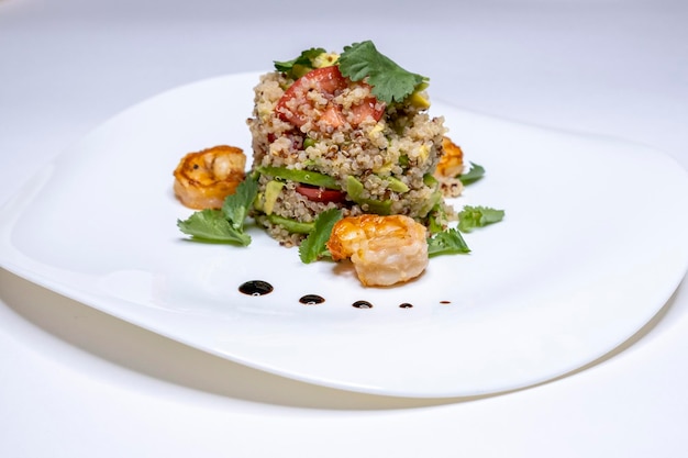 Shrimp salad on a white plate Shrimps tomatoes Restaurant menu Home cooking cous cous Copy space Place for text