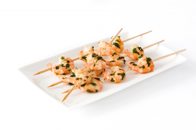 Shrimp skewers on white