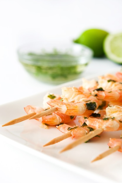 Shrimp skewers on white