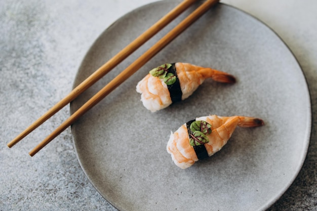 Shrimp sushi on a gray plate shot from above