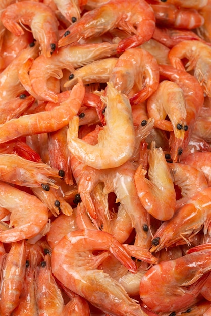 Photo shrimps background texture. a lot of shrimps. cooked shrimps.