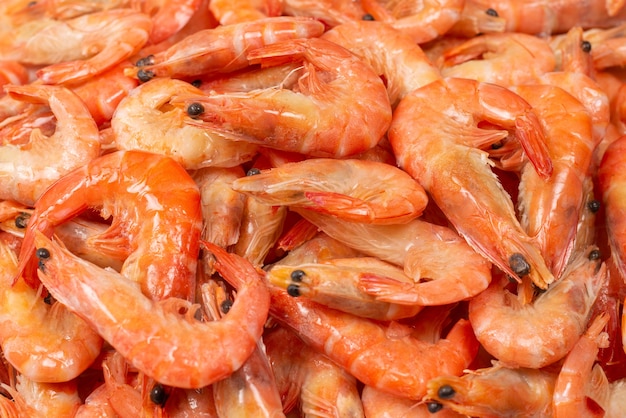 Photo shrimps background texture. a lot of shrimps. cooked shrimps.