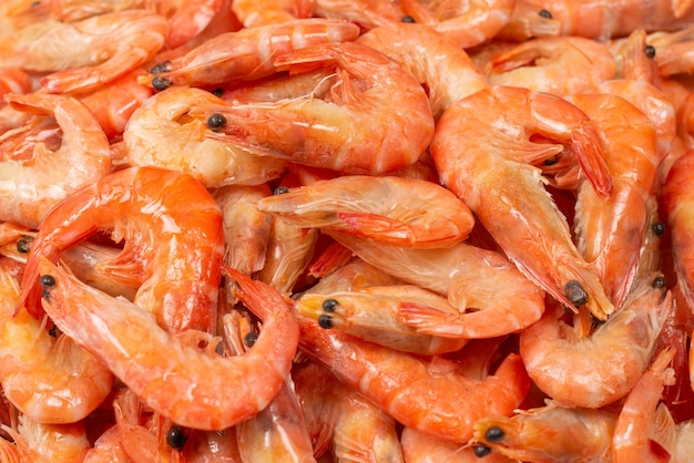 Shrimps background texture. A lot of shrimps. Cooked shrimps.