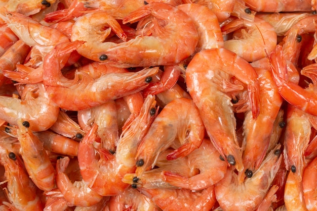 Photo shrimps background texture. a lot of shrimps. cooked shrimps.