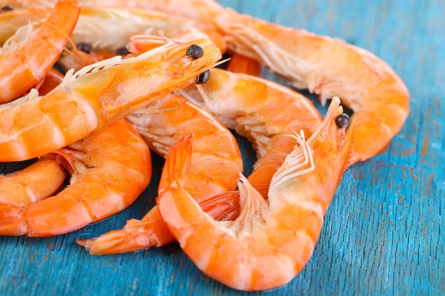 Shrimps on blue wooden table