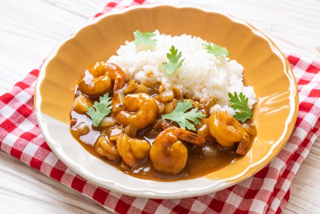 Shrimps in curry sauce on rice