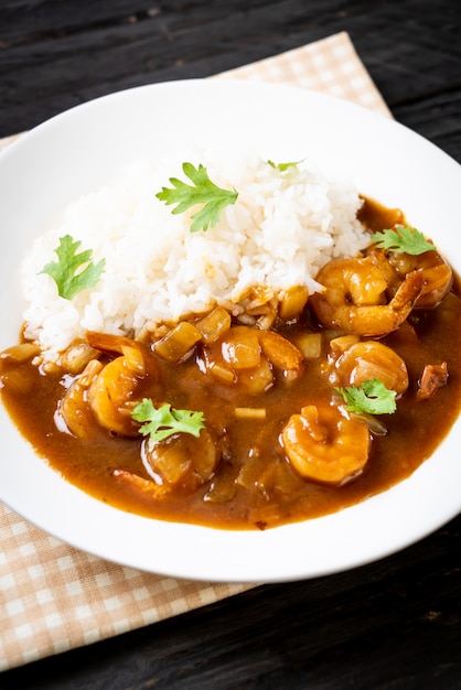 Shrimps in curry sauce on rice