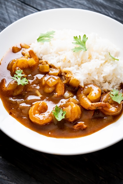 Shrimps in curry sauce on rice