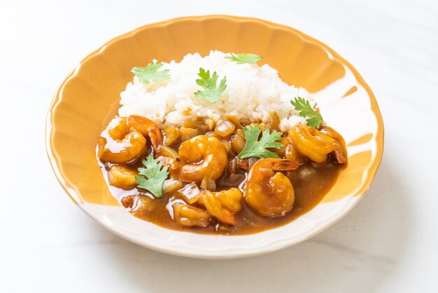 Shrimps in curry sauce on rice