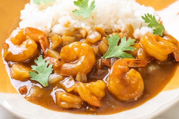 Shrimps in curry sauce on rice