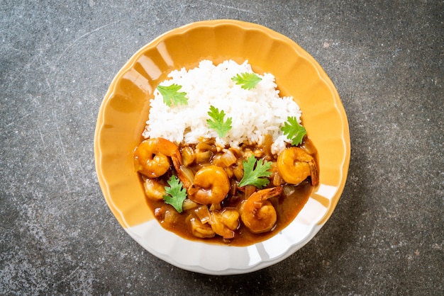 Shrimps in curry sauce on rice