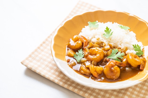 Shrimps in curry sauce on rice