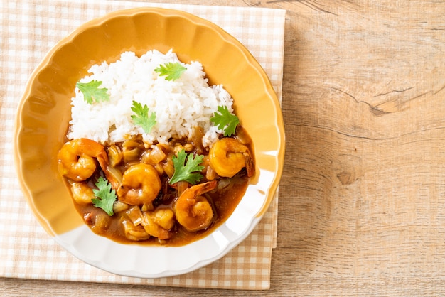 Shrimps in curry sauce on rice