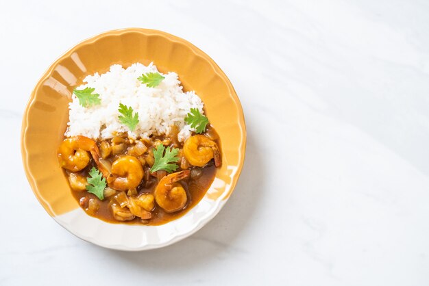 Shrimps in curry sauce on rice