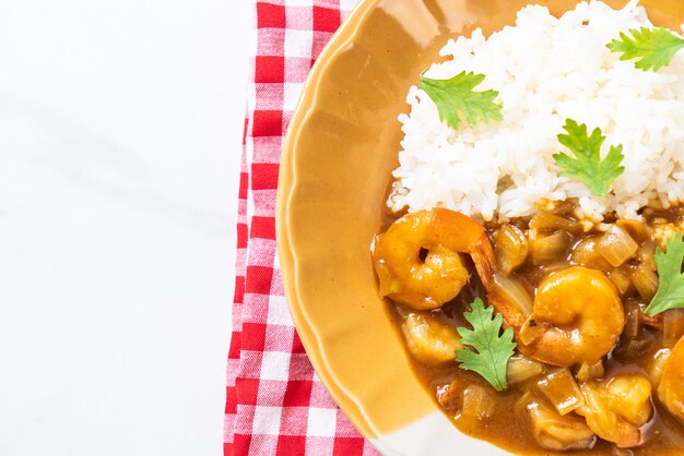 Shrimps in curry sauce on rice