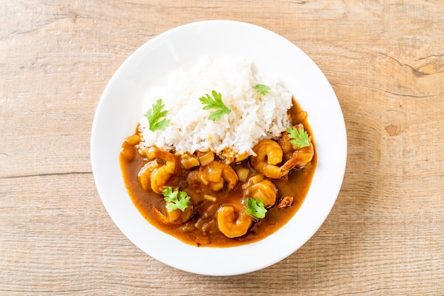 Shrimps in curry sauce on rice