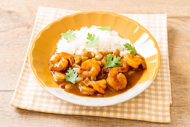 Shrimps in curry sauce on rice