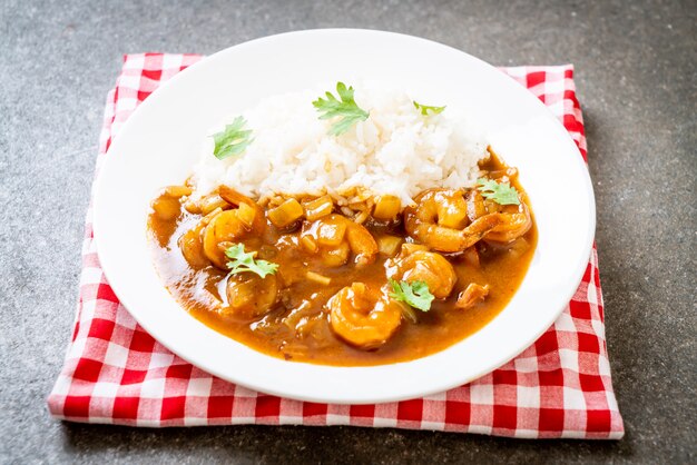 Shrimps in curry sauce on rice