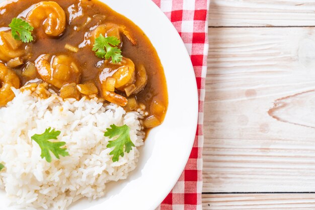 Shrimps in curry sauce on rice