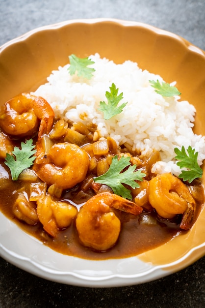 Shrimps in curry sauce on rice