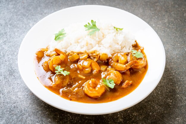 Shrimps in curry sauce on rice