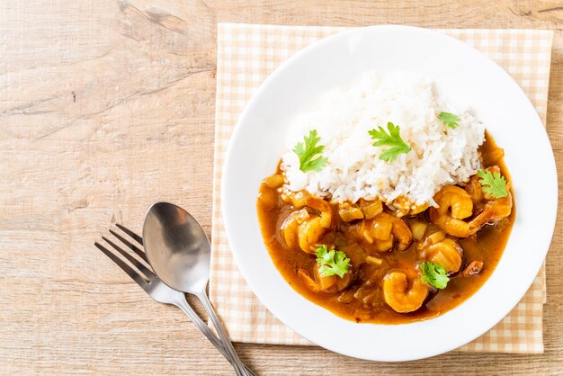 Shrimps in curry sauce on rice