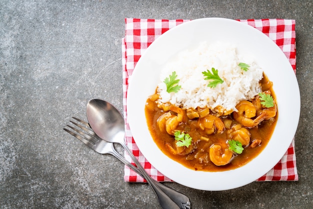 Shrimps in curry sauce on rice