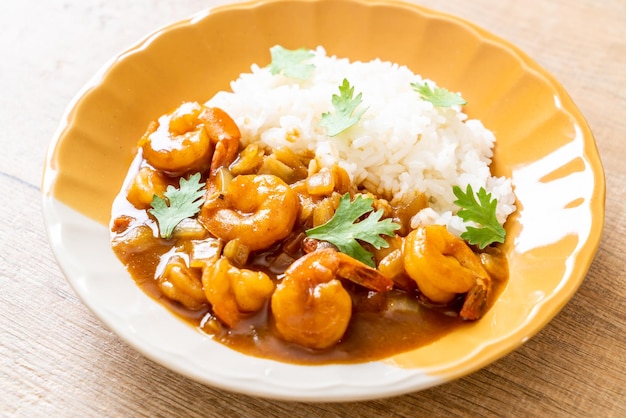 Shrimps in curry sauce on topped rice