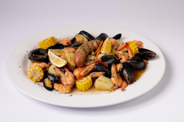 Shrimps and mussels clawdaddy boil in a dish top view on grey\
background singapore food