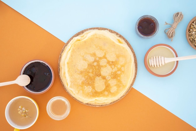 Shrovetide Maslenitsa Butter Week festival meal Russian pancakes with butter honey and jam