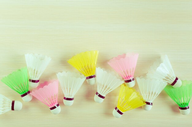 Shuttlecock on wooden background