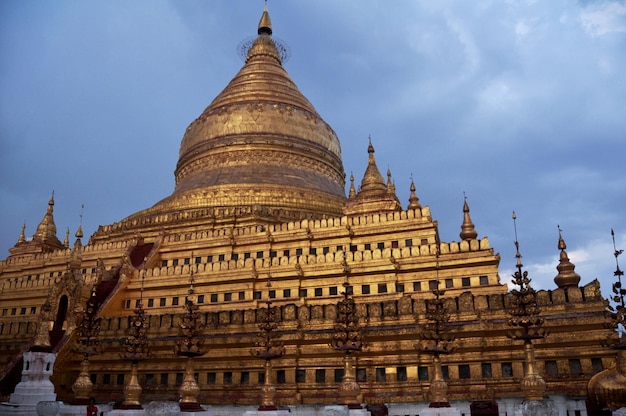 Shwezigon Stupa Pagoda Paya of burmese temple for burma people and foreign travelers travel visit and respect praying in Nyaung U town at Bagan or Pagan ancient heritage city site in Mandalay Myanmar