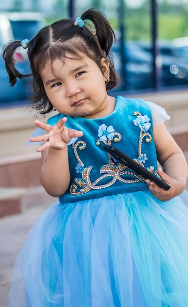 Shymkent Kazakhstan May 16 2018 A holiday at the city hippodrome in honor of the beginning of the Holy month of Ramadan Children in national costumes at the festival