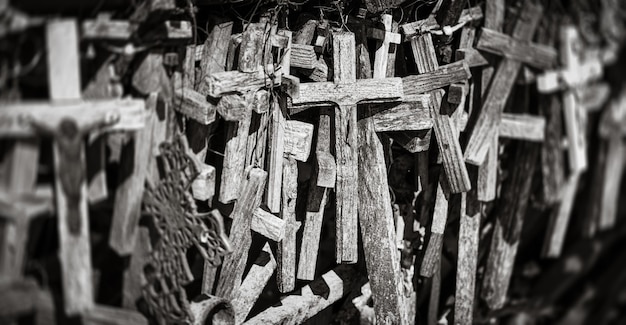 SIAULIAI, LITHUANIA - JUL 22, 2018: Hill of Crosses is a unique monument of history and religious folk art. Text on the crosses in different languages - O God, protect our family, give health.