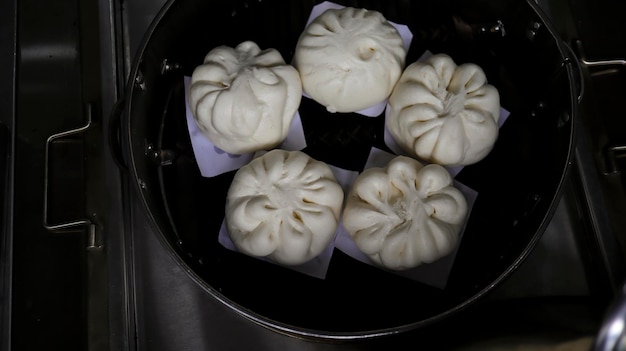 Siaupao or pork bun or steamed buns or siopao pork in a stainless streamer